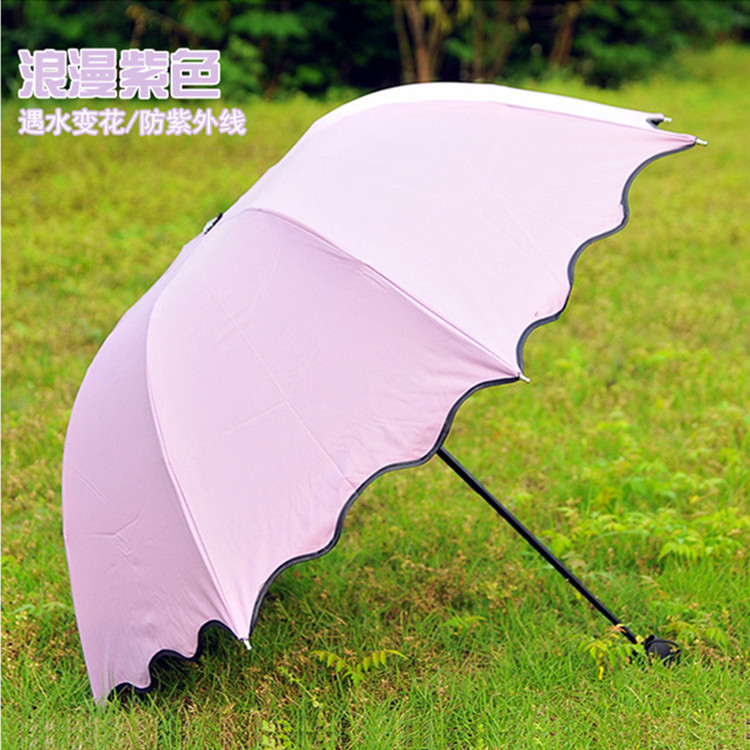 廠傢直銷創意遇水變花傘帶黑膠防紫外線遮陽傘便攜戶外小黑傘雨傘工廠,批發,進口,代購